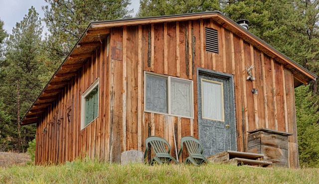 Frontier-style cabin with kitchen & wood stove.