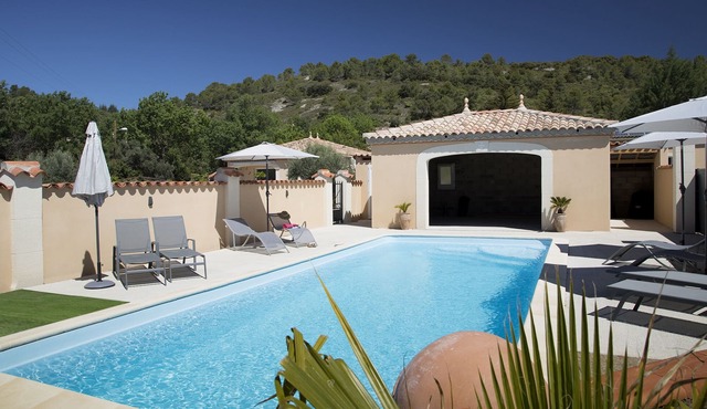 Fully air conditioned with private parking and large shared pool.