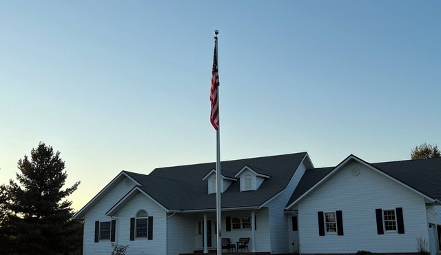 Fully custom modern four bedroom home on 13 acres with a stocked pond.