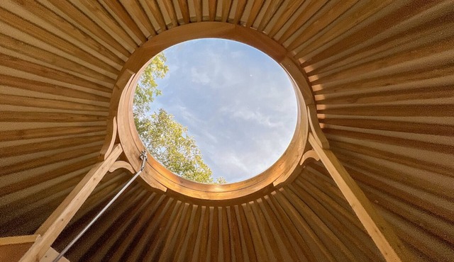 Fully equipped "Machu Picchu" ethnic yurt near a large lake.