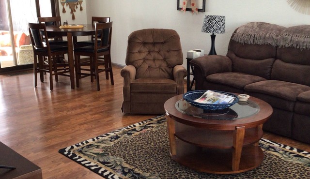 Fully furnished 3 bedroom ranch style home with large screened in porch w/garage
