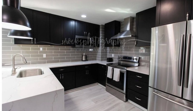 Fully furnished clean modern apartment, private covered deck, quiet wooded view.