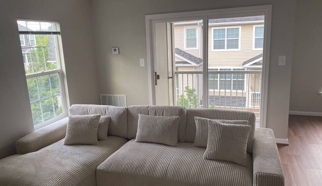Fully furnished room in sun-drenched condo. 7 minute walk to Wheaton metro.