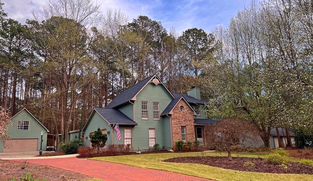 FULLY FURNISHED with GOLF CART and Extra Two Car Garage with Storage in the Back