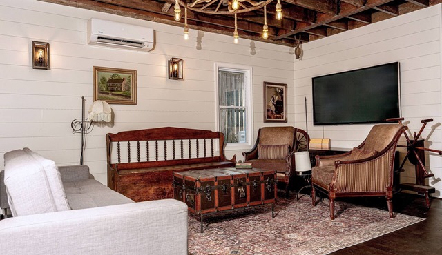 Fully renovated 1800s Carriage House seamlessly blends history w/modern luxury.