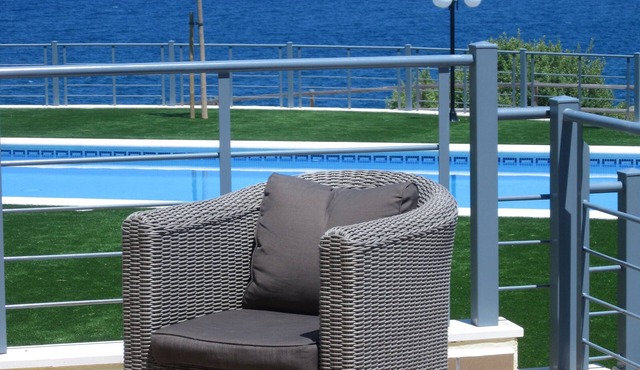 garden level apartment with full sea views in residence with swimming pool.