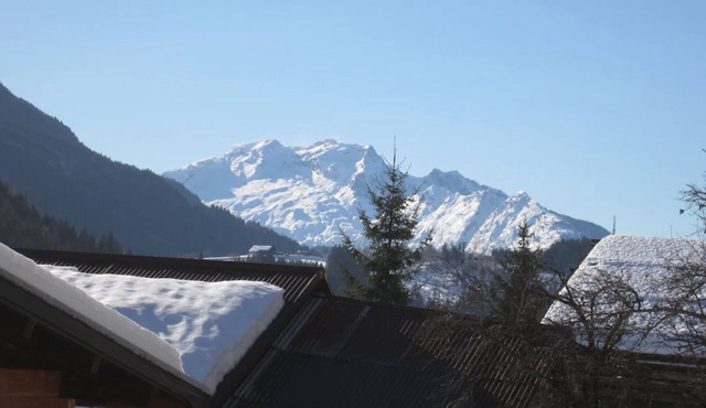 Garden level with south-facing terrace and view of the Aravis massif