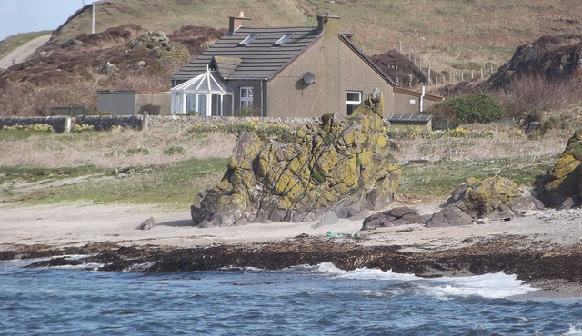 A detached cottage with views across to Gigha and the Paps of Jura.