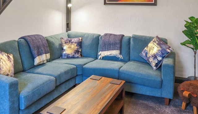 A charming cottage with distant sea views, in a peaceful setting.