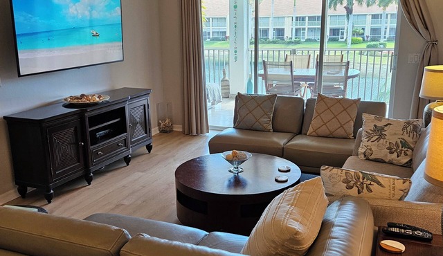 Generously sized updated lanai showcasing a prime mid-water south view.