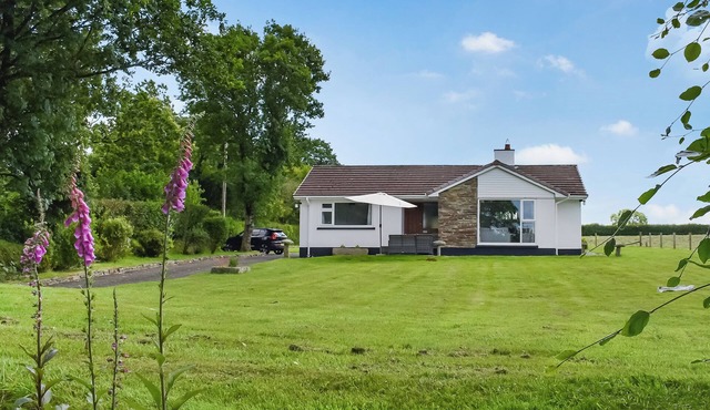 Get back to nature in this lovely, three-bedroom, rural bungalow.