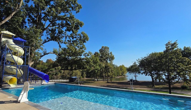 Giant 10-bedroom lakefront home with large pool, hot tub, and dock