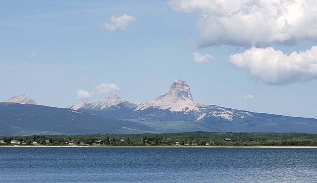 Glacier National Park views from this private nearby Duck lake waterfront home.