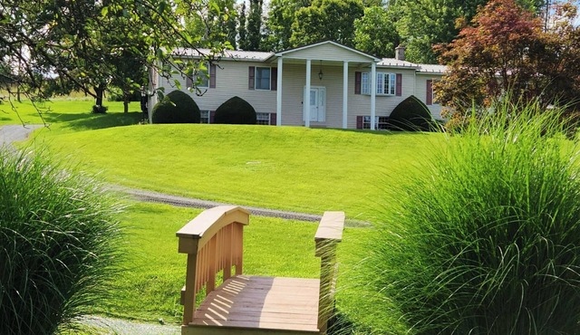 Glade Run House - A quiet country home retreat with a stream running through it.