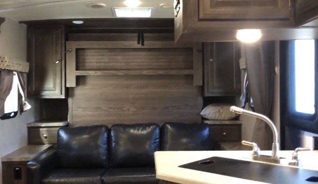 Glamp in a cozy RV waking up to Nature Trails out your front door.