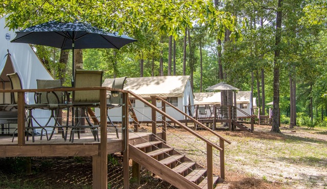 Glamping tents overlooking a 70 acre lake