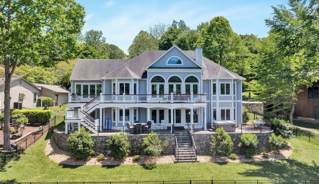 Go Jump In the Lake! Just Listed Custom Lakefront Home with Dock & Amenities!