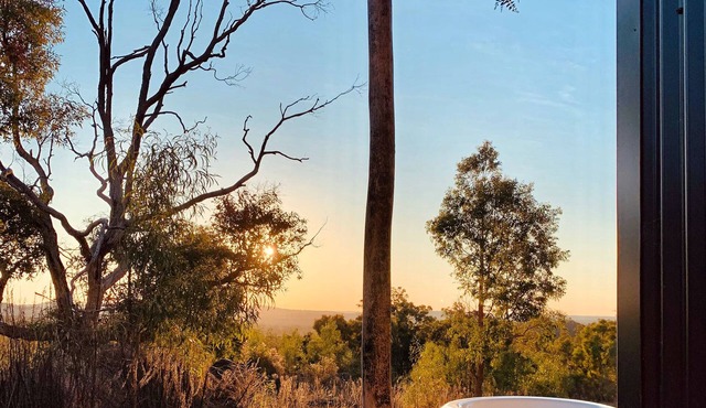 Golden Hour Views: Sunset Cabin with Outdoor Bath