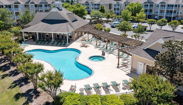 Golf community condo near beach with on-site pool, golf, & screened balcony
