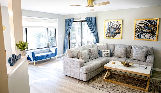 Golf course adjacent, beach-themed condo with sunroom, washer/dryer, & AC