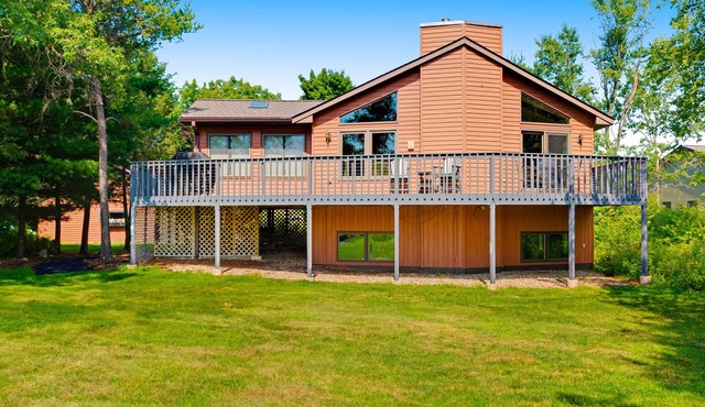 Golf course-front home with 2 pools, private beach, boat launches, tennis, grill