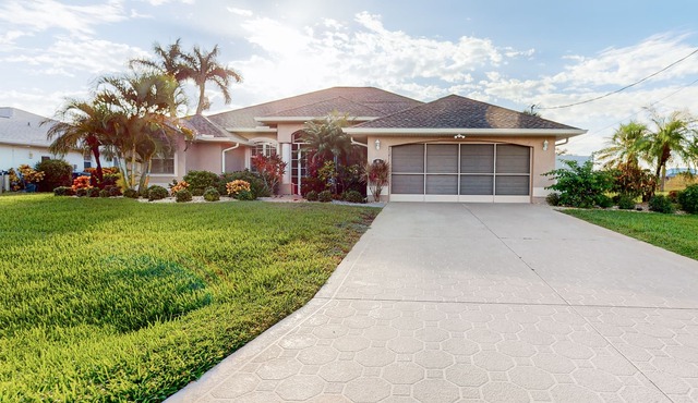 Golf course-view retreat with a private, heated pool, lanai, AC, & washer/dryer