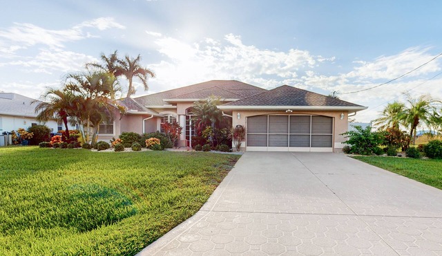 Golf course-view retreat with a private, heated pool, lanai, AC, & washer/dryer