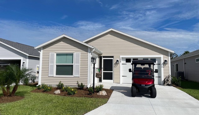 Golf & water views meet fresh style in this brand-new Florida retreat!
