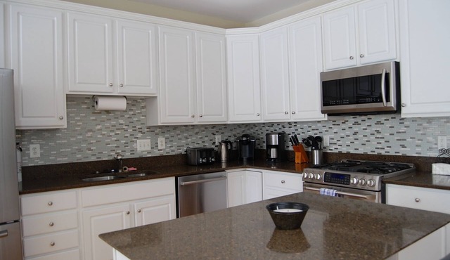 Golfers? Kids? Pets? This elegant town home is beautifully furnished and is located in the Bay Hills golf course community.