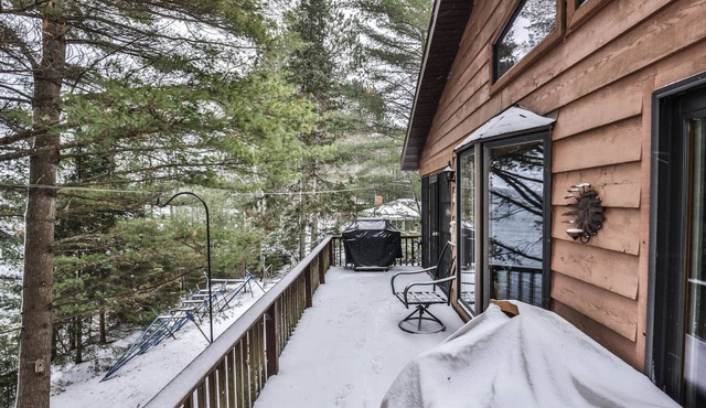 Gorgeous 5 bedroom home on Two Sisters Lake with direct snowmobile access!