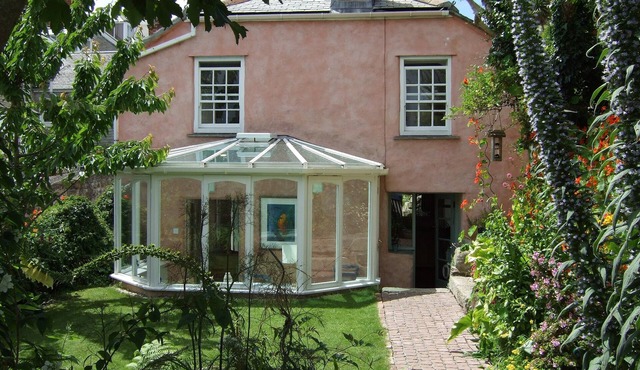 Gorgeous artist's cottage with secluded garden and sea views from all rooms.