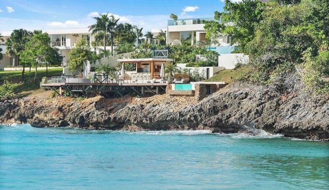 Gorgeous Beach House Perched Right Over the Ocean