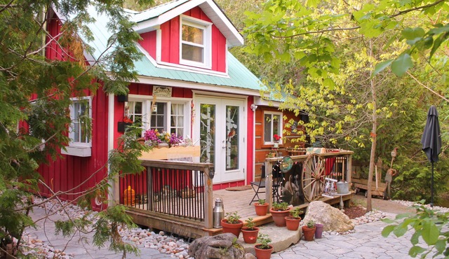 Gorgeous cozy cottage besides a bustling stream, surrounded by gorgeous greenery