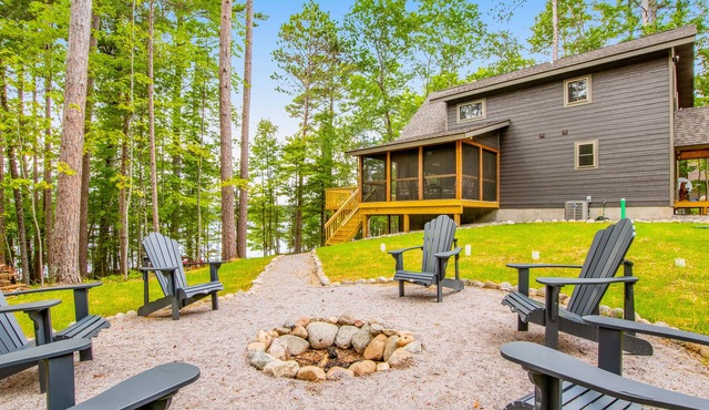 Gorgeous lake home with private pier, beach, firepit, deck, & grill + water toys