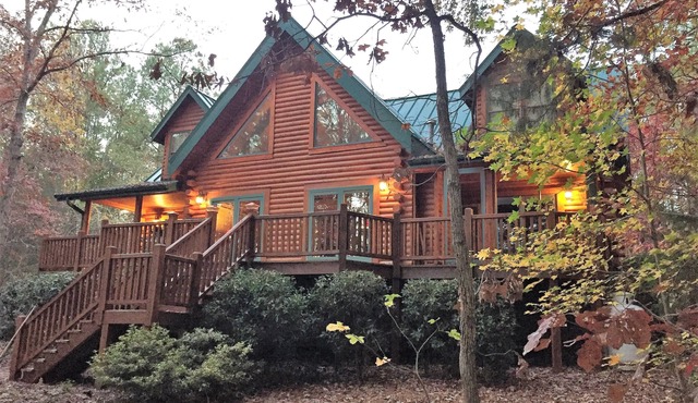 Gorgeous lakefront log home on secluded cove with private beach and boat dock