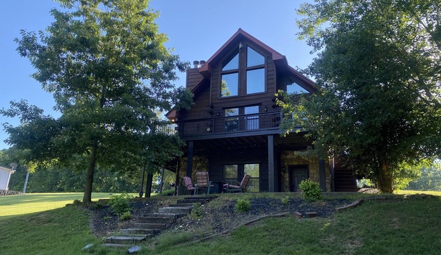 Gorgeous large waterfront log lake home with private dock!