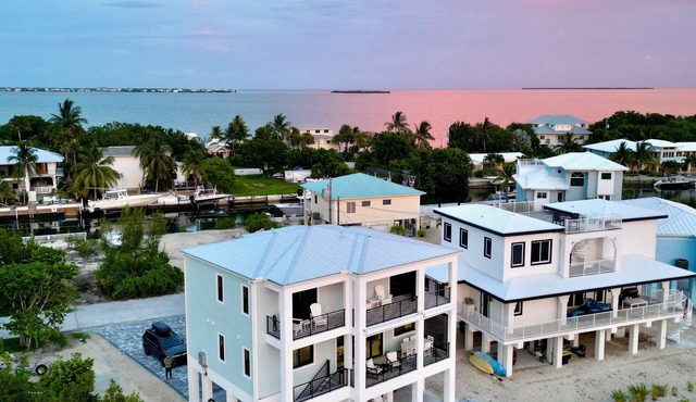 Gorgeous new build on Cudjoe Marina Basin with 80 ft boat dock and private pool