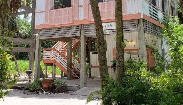 Gorgeously-appointed 4-bedroom beach home steps away from pristine beaches.