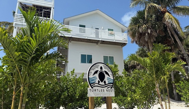 Gorgeously-appointed 4-bedroom beach home steps away from pristine beaches