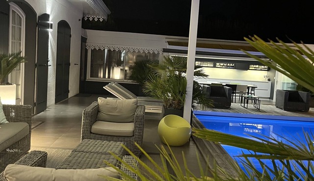 Grand Standing air-conditioned family home with heated spa pool and sauna.