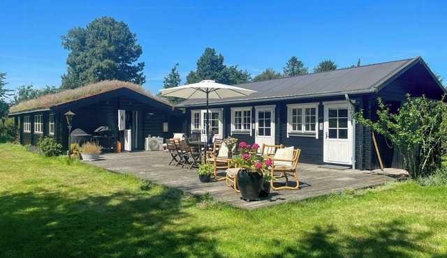 Grass-roofed cottage with fruit garden in Skaverup