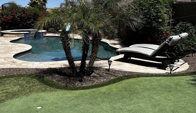 Great family friendly home very private back yard, heated pool & covered patio.