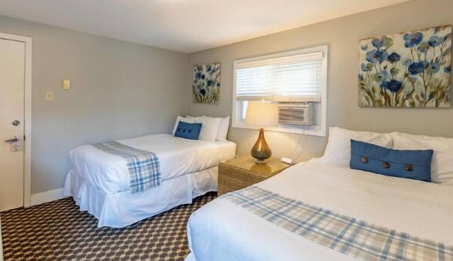 Great room with two Full beds. Lake view from deck