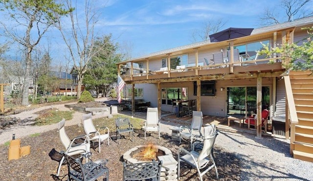 Green side smart home with golf, beach/lake access, off-site dock & EV charger