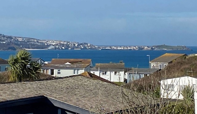 Greendune is a modern holiday chalet with great coastal views which take in Carbis Bay and St Ives