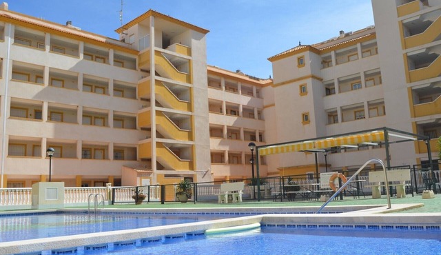 Ground floor apartment with large patio, communal pool
