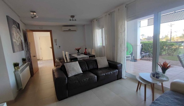Ground Floor Apartment with Terrace and Garden facing a huge Swimming Pool