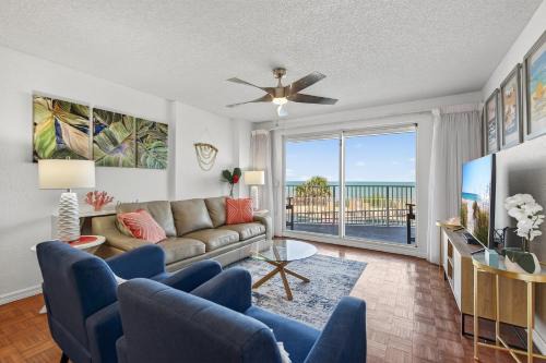 Ground floor direct oceanfront 2/2 with a balcony, heated pool, and garage parking