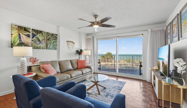 Ground floor direct oceanfront 2/2 with a balcony, heated pool, and garage parking