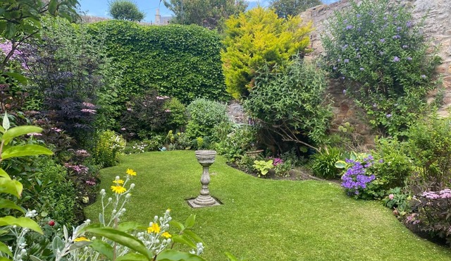 Ground Floor garden apartment only a few steps from the shore.